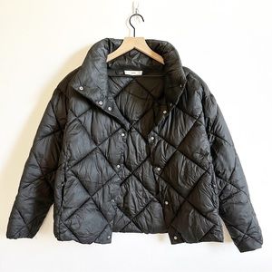 Mango diamond quilted puffer jacket in black Clearance